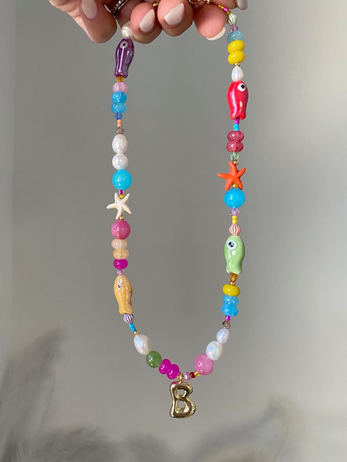 Ocean necklace with a gold bubble initial B charm