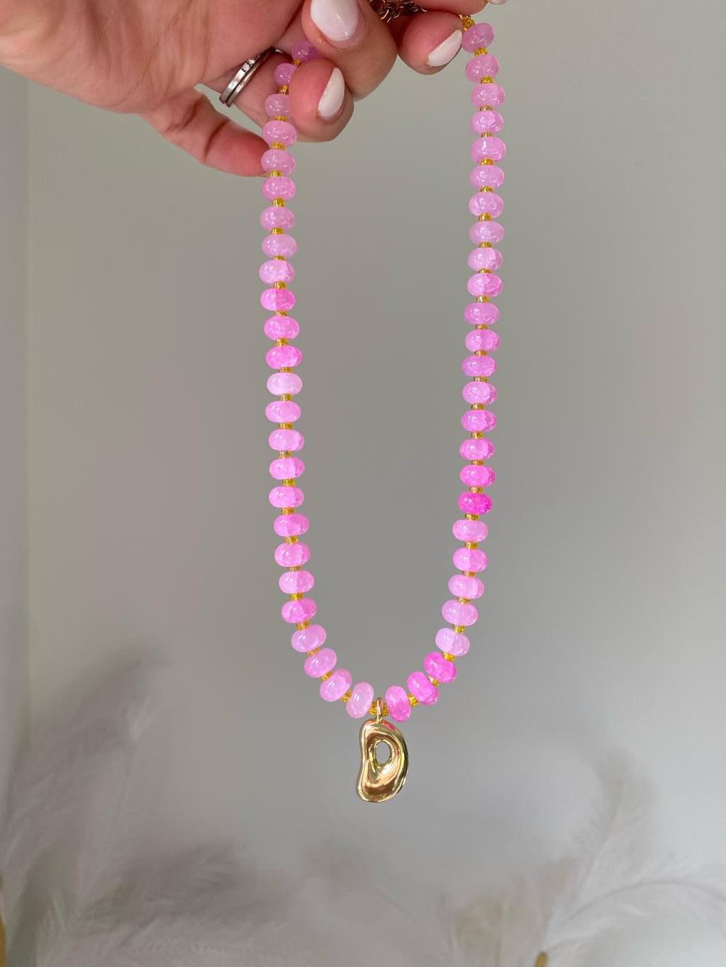 Francesca necklace with a single gold bubble letter D charm