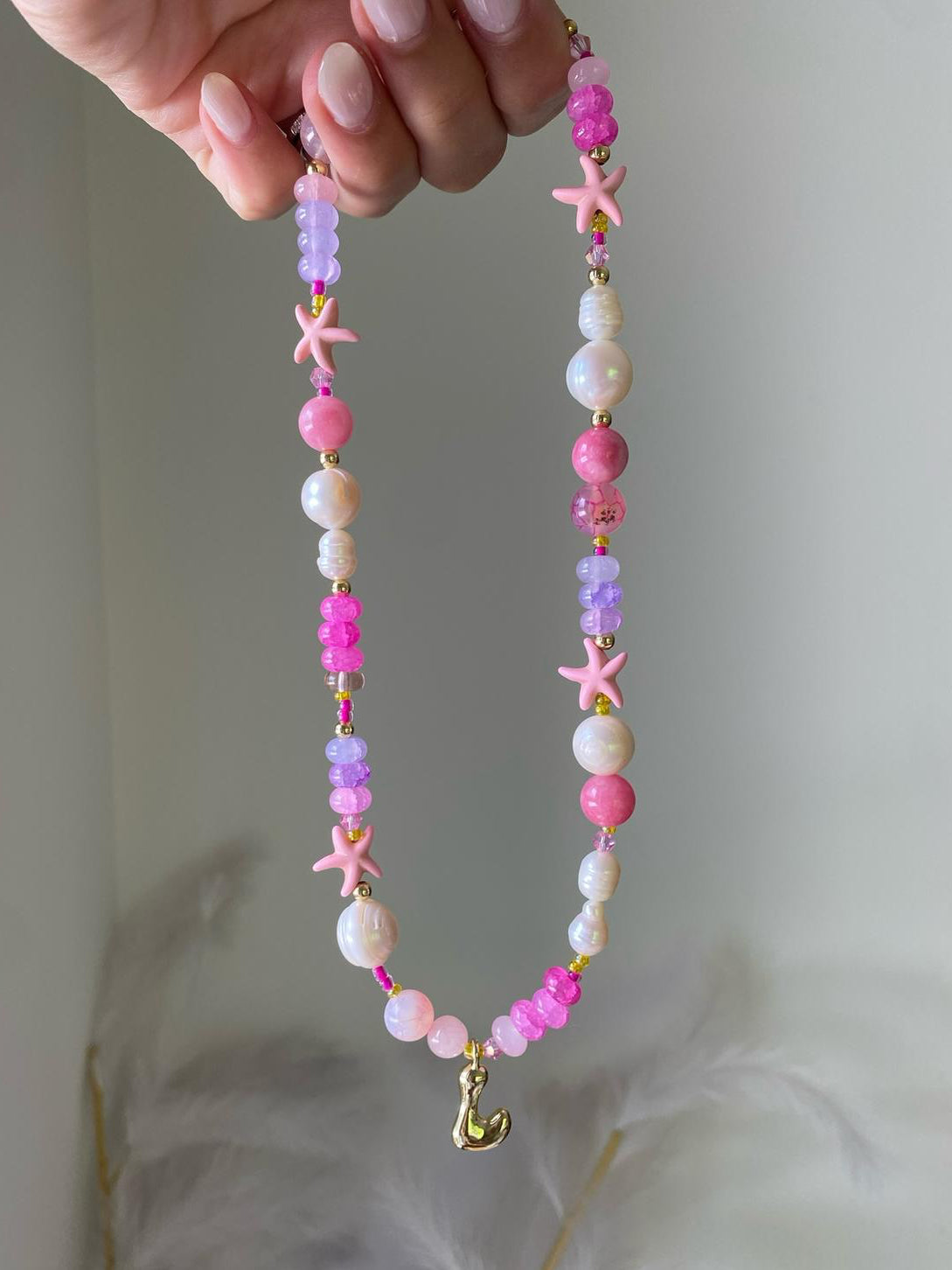 Viola necklace with a gold bubble letter J initial pendant