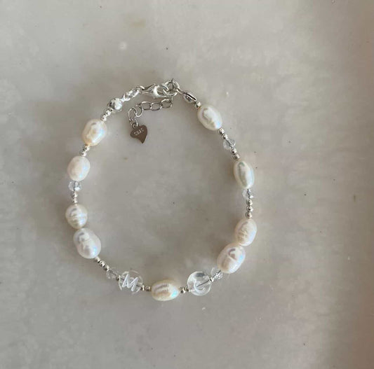 Sterling silver bracelet with freshwater pearls, and clear acrylic beads with the initials M and C.