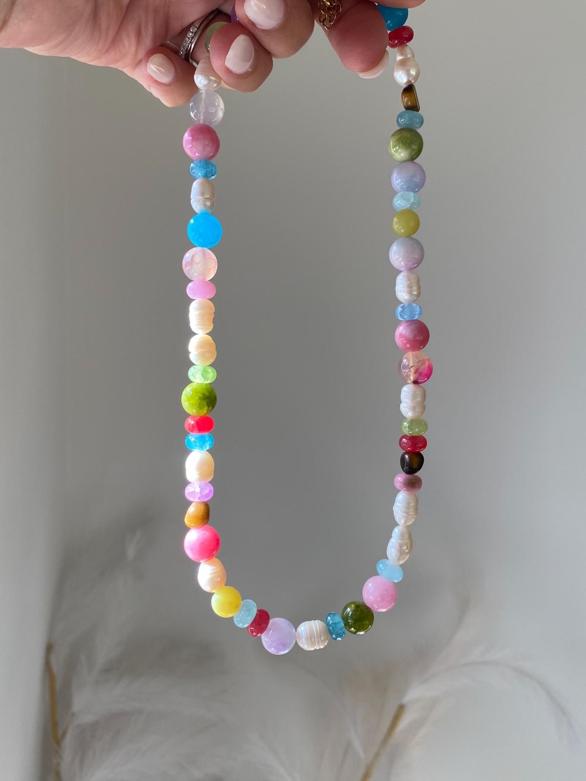 Beaded necklace with multicolour round gemstone beads and freshwater pearls in pink, blue, green, yellow, and lilac